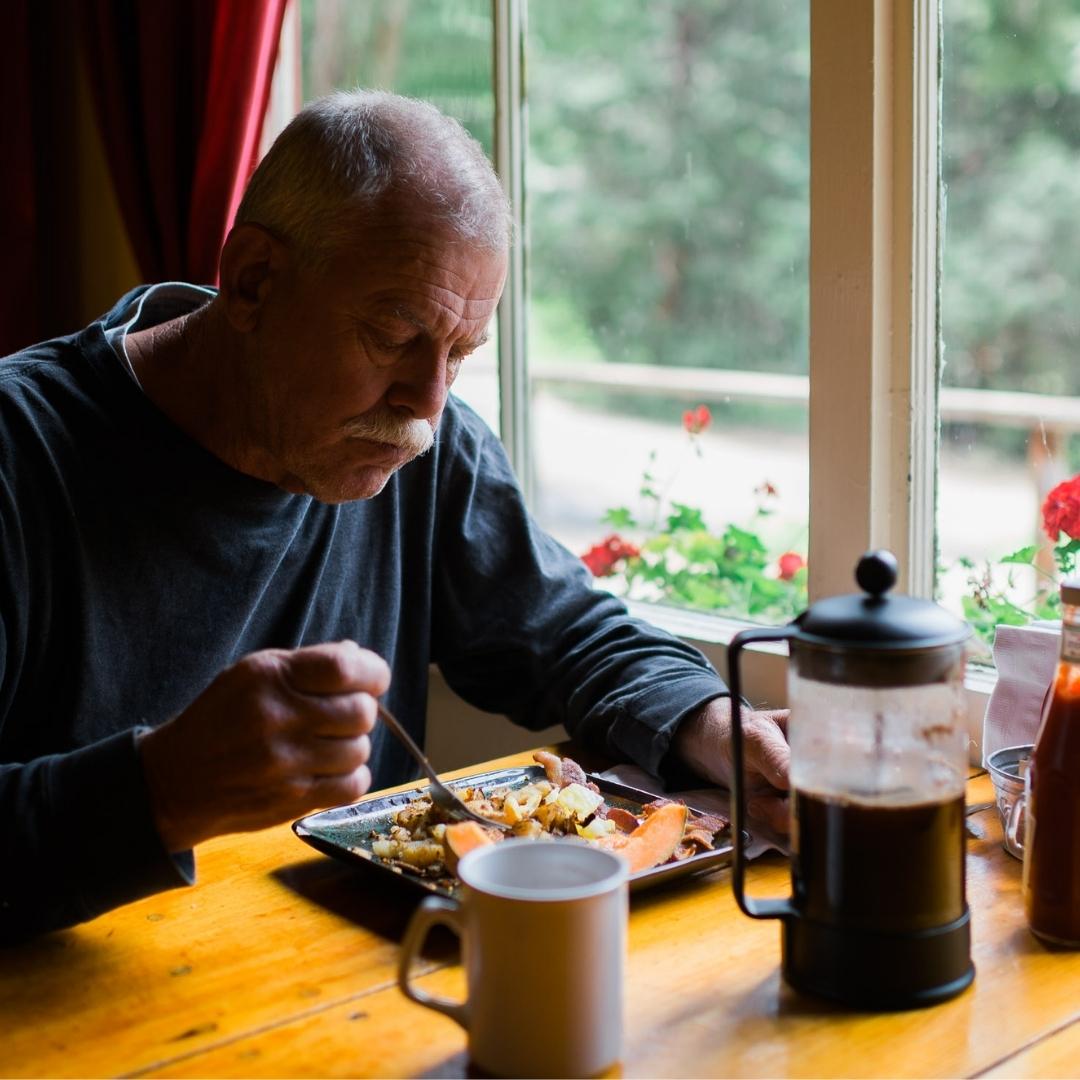 Man enjoying a meal at Silver City Store Restaurant